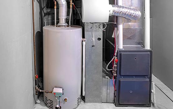 A worker replacing heating systems