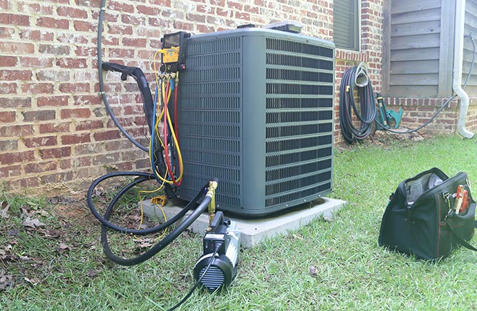 Professional worker maintaining heating system