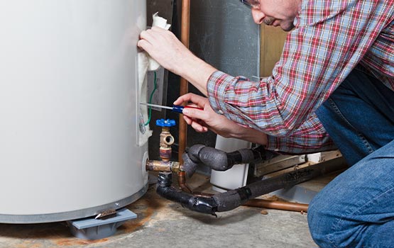 A worker replacing a heating system